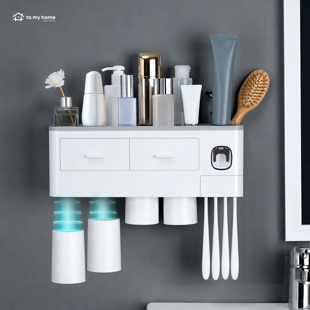 No-drill bathroom toothbrush organizer with automatic toothpaste dispenser, inverted magnetic cups, and tray for toiletries, razors, and cosmetics in compact wall-mounted spaces Tomyhome Global